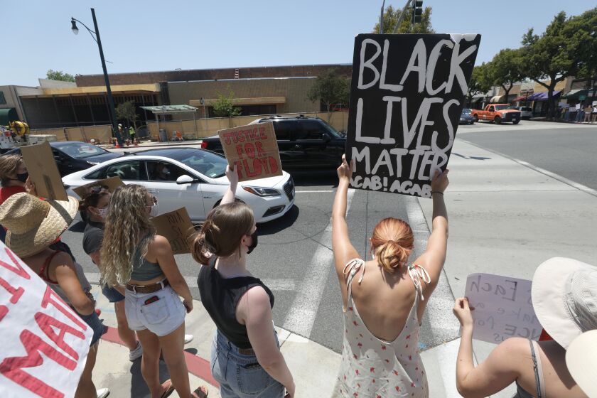 SOUTH PASADENA, CA - JUNE 03: A peaceful protest is held on Fair Oaks Avenue on Wednesday, June 3, 2020 in South Pasadena, CA. The protest was organized by London Lang who was a looter in Saturday's protest in the Fairfax District. When he realized the error of his ways, he returned the clothes the next day and asked the retailer for forgiveness. (Myung J. Chun / Los Angeles Times)