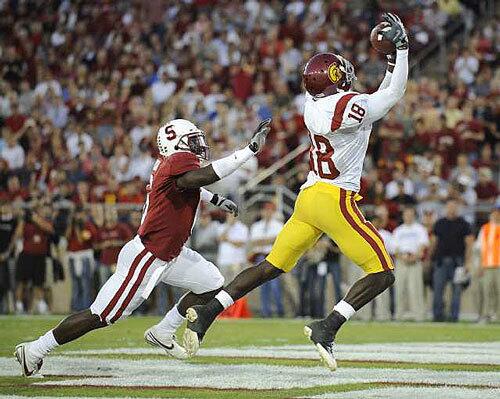 USC's Damian Williams makes a touchdown catch in front of Stanford's Wopamo Osaisai in the second quarter Saturday.