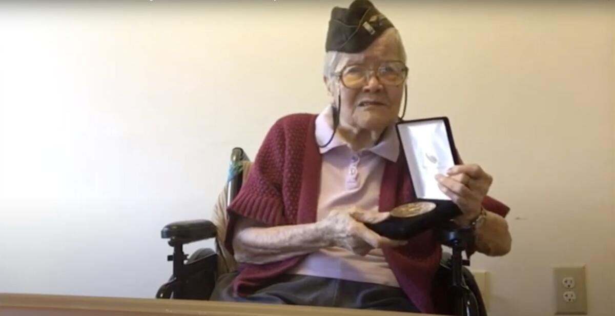 In this image from House Television video, 1st Lt. Elsie Chin Yuen Seetoo, accepts a Congressional Gold Medal during a virtual ceremony broadcast from Capitol Hill in Washington, Wednesday, Dec. 9, 2020. Seventy-five years after World War II ended, Congress is honoring thousands of Chinese Americans who served the United States in the war, earning citations for heroism despite institutional discrimination that included limits on how many Chinese people were allowed in the U.S. Nearly 20,000 people of Chinese ancestry served in the U.S. military during World War II, including about 40 percent who were not U.S. citizens due to laws such as the Chinese Exclusion Act, which made it illegal for Chinese laborers to immigrate to the U.S. and limited the Chinese population in the U.S. for more than 60 years. (House Television via AP)