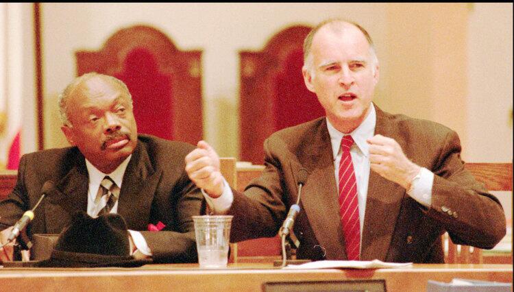 Former Gov. Brown speaks in the State Senate as San Francisco Mayor Willie Brown looks on.