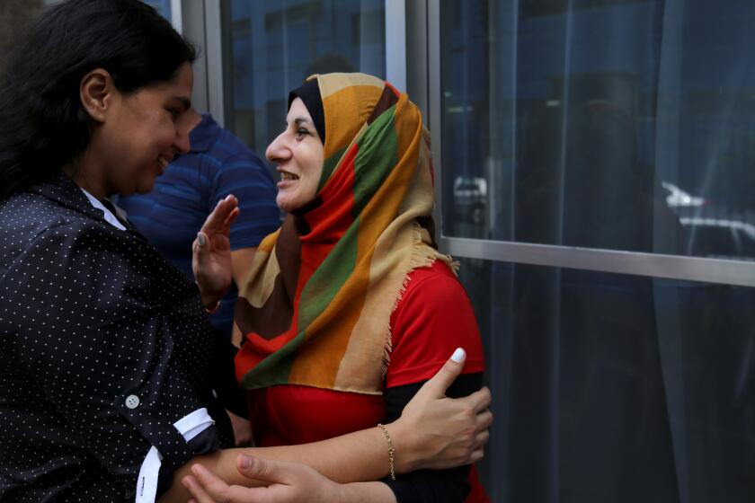 Muna Darweesh, right, chats with a friend while on an outing with her family. Like many of the Syrian refugees who have been trickling into Brazil, she came as a last resort. “I didn’t choose Brazil,” she says. “It was the only country that would take us.”