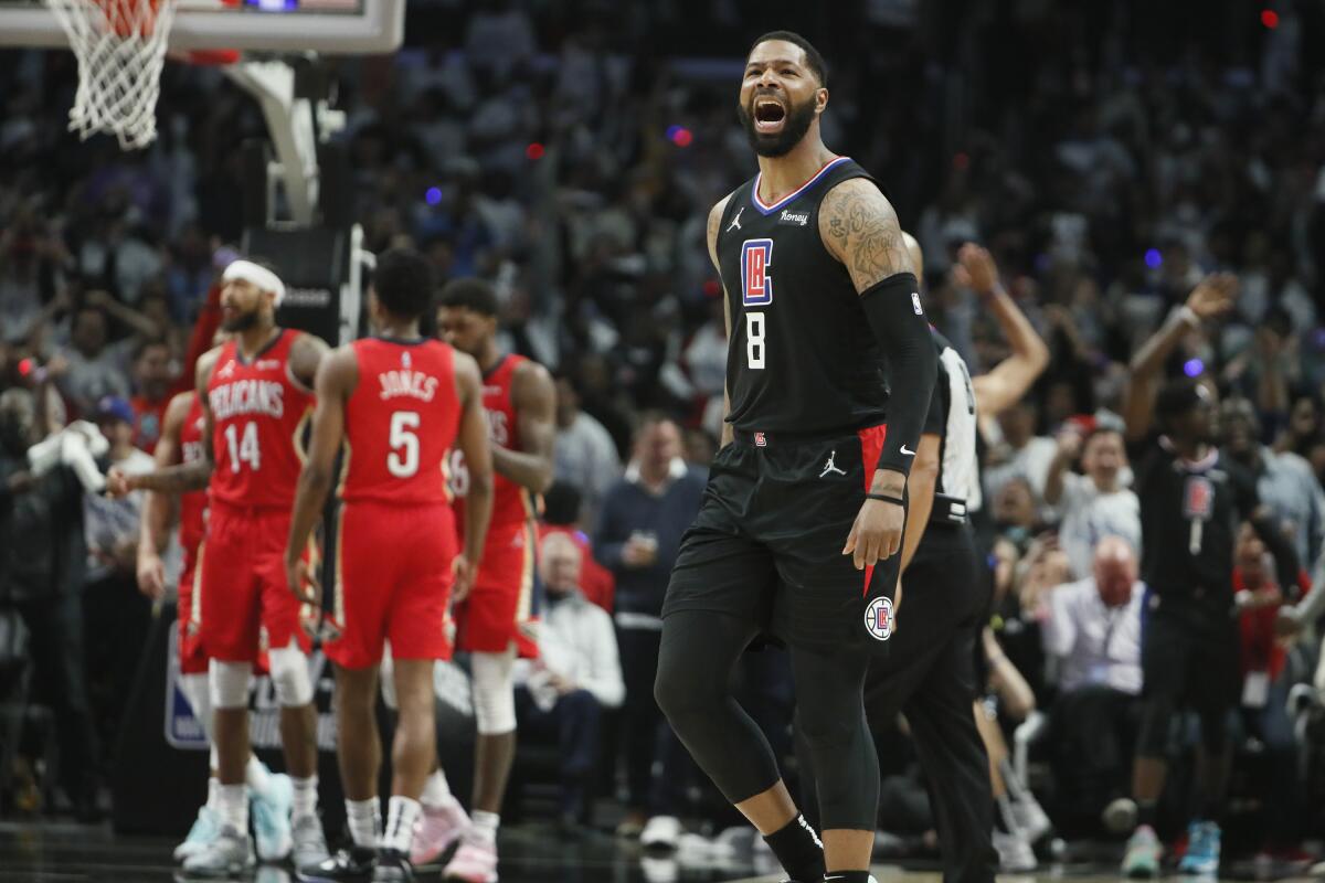 Clippers forward Marcus Morris Sr. yells after making a three-pointer against the Pelicans.