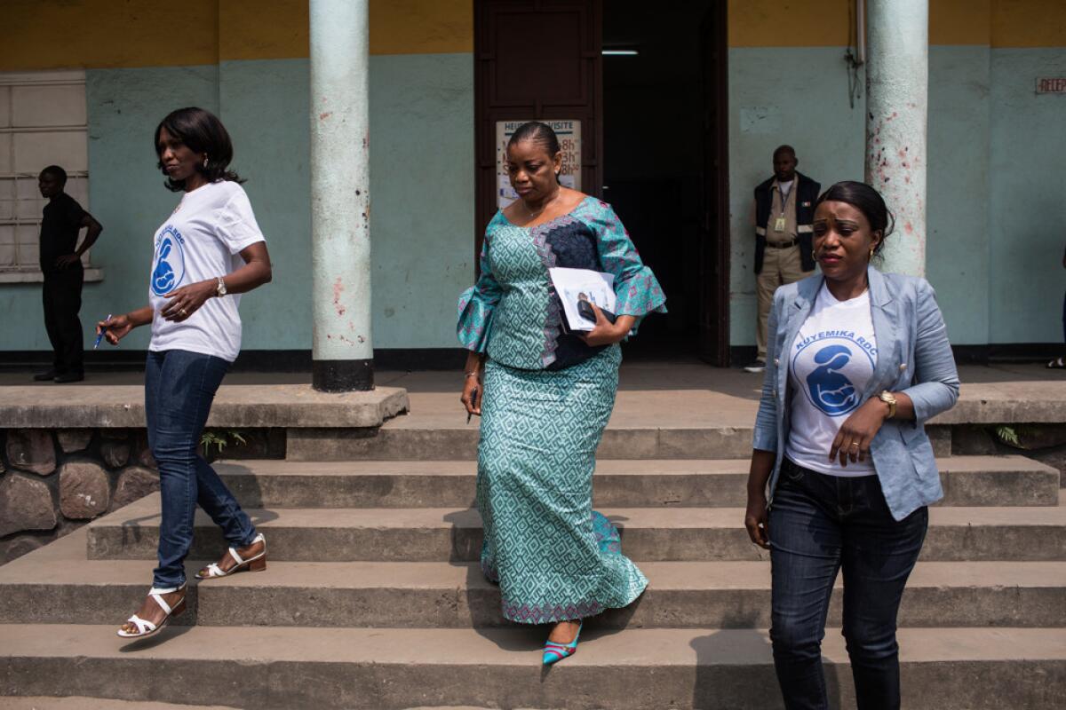 Congolese Member of Parliament Eve Bazaiba, center, arrives at an opening event for the "Week of Maternal Health" campaign at a maternity hospital in Kinshasa, Democratic Republic of Congo on Aug. 23.