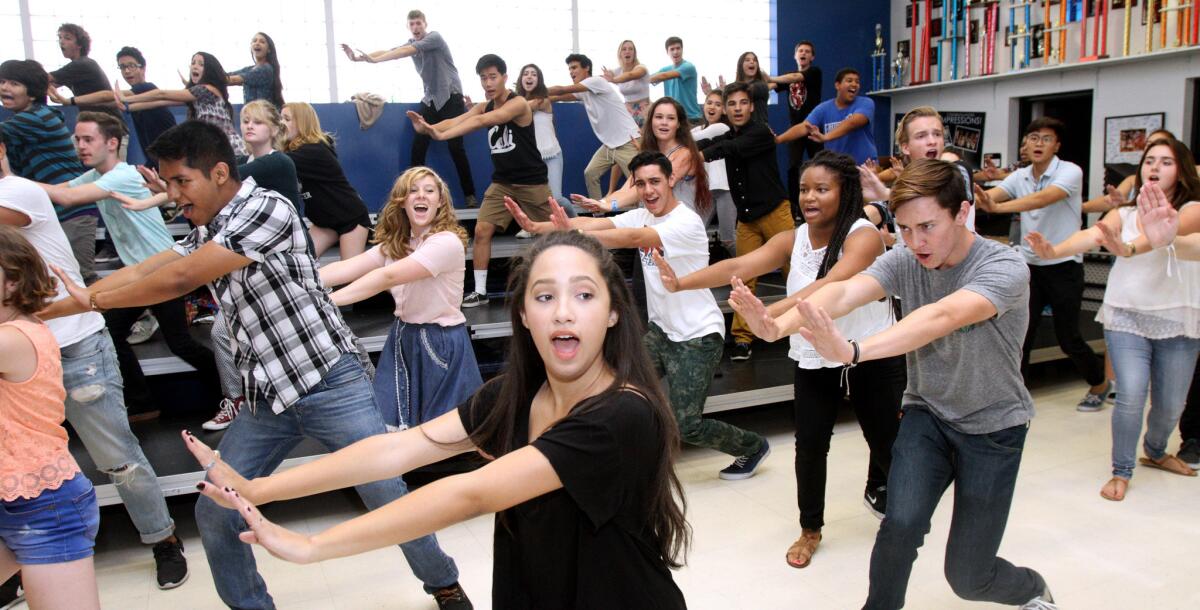 Burbank High School's Noa Drake, center, sings and dances along with the rest of the members of the school's show choir during practice at the school in Burbank on Tuesday, September 22, 2015. The choir will performed on stage with Megan Hilty on September 24 at the Valley Performing Arts Center in Northridge.