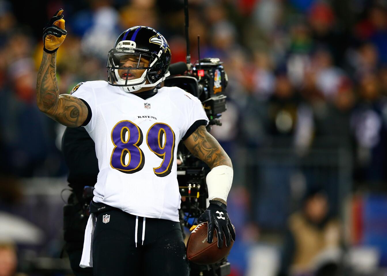 Ravens receiver Steve Smith celebrates after scoring a touchdown in the first quarter against the New England Patriots during the 2014 AFC divisional playoffs at Gillette Stadium.