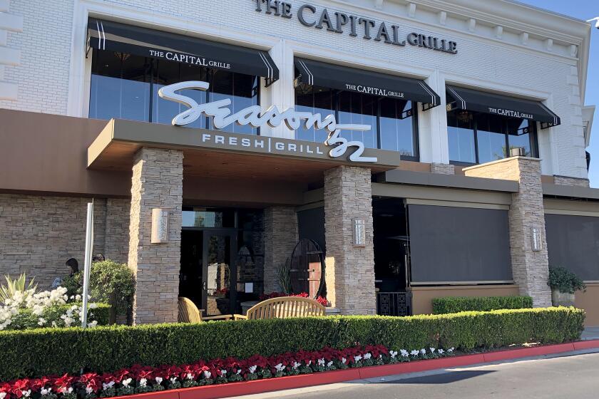 Seasons 52 restaurant at South Coast Plaza. Costa Mesa police are searching for a group of 3-5 men wearing masks, black clothing and hooded sweatshirts who entered the restaurant's patio Monday evening at around 7:13 p.m. and ordered patrons on the ground at gunpoint. The suspects made off with one handbag before fleeing the scene in a white Buick sedan.
