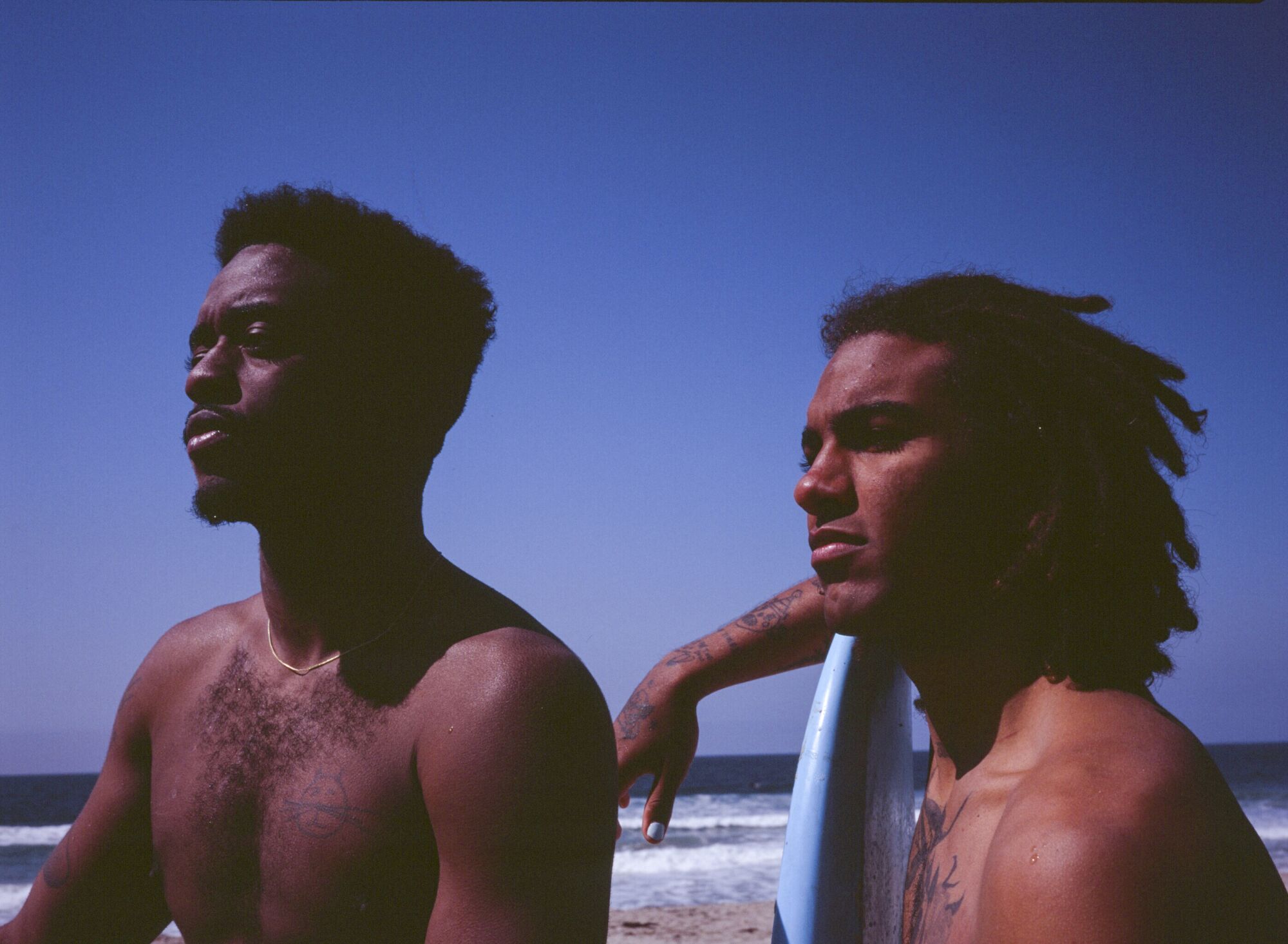 Brick Howze and Gage Crismond pose a portrait after a morning surf session on Saturday, March 13, 2021.