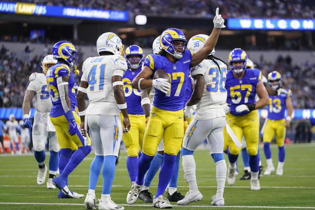 Rams wide receiver Puka Nacua celebrates after making a touchdown catch against the Chargers on Saturday.