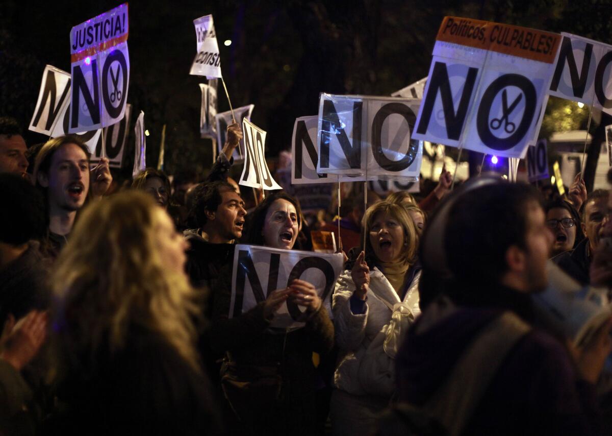 Protesters shout slogans against austerity measures announced by the Spanish government on Oct. 27. One Spaniard in four is now unemployed.