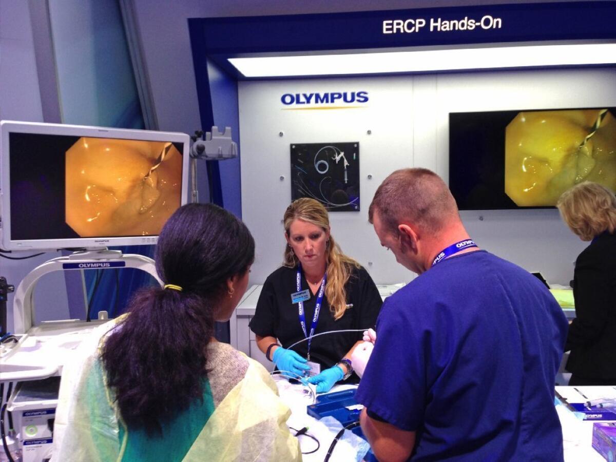 Huntington Memorial Hospital in Pasadena has notified patients who may have been infected by a contaminated medical scope made by Olympus Corp. Above, Olympus showcases its ERCP scopes at a Washington medical conference in May.
