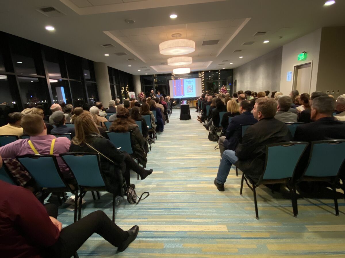 There is not an empty seat or a dry eye in the house as friends and family tell their favorite Bradley Fikes stories at the Springhill Marriott, Dec. 12.