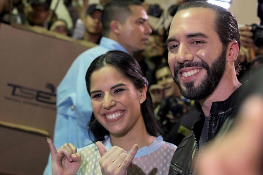 Salvadorean presidential candidate Nayib Bukele (R), of the Great National Alliance (GANA), and his wife Gabriela Rodriguez, pose after voting during the Salvadorean presidential election at a polling station in San Salvador, on February 3, 2019. - Polls opened Sunday in El Salvador's presidential elections amid heavy security as voters look for change in a country beset by gang violence and widespread poverty. (Photo by Marvin RECINOS / AFP)MARVIN RECINOS/AFP/Getty Images ** OUTS - ELSENT, FPG, CM - OUTS * NM, PH, VA if sourced by CT, LA or MoD **