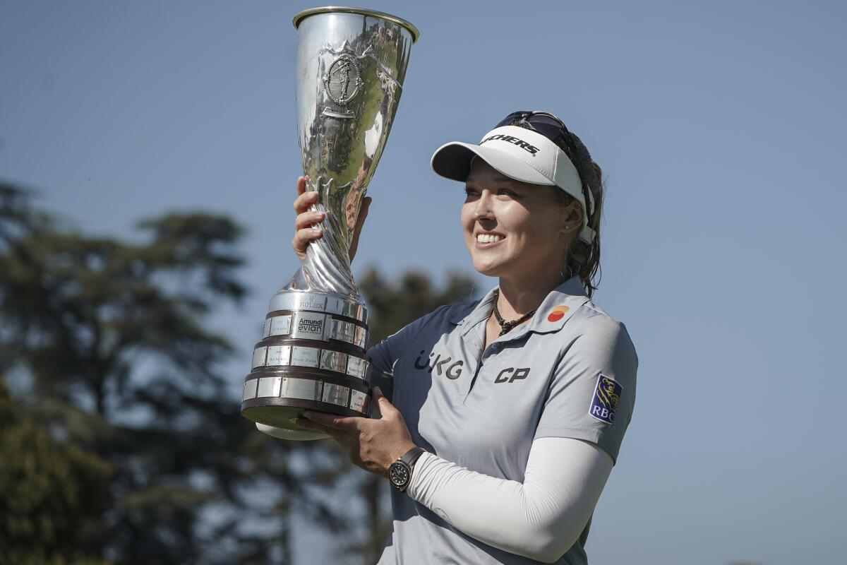 Brooke Henderson celebrates after winning the Evian Championship in France on Sunday.