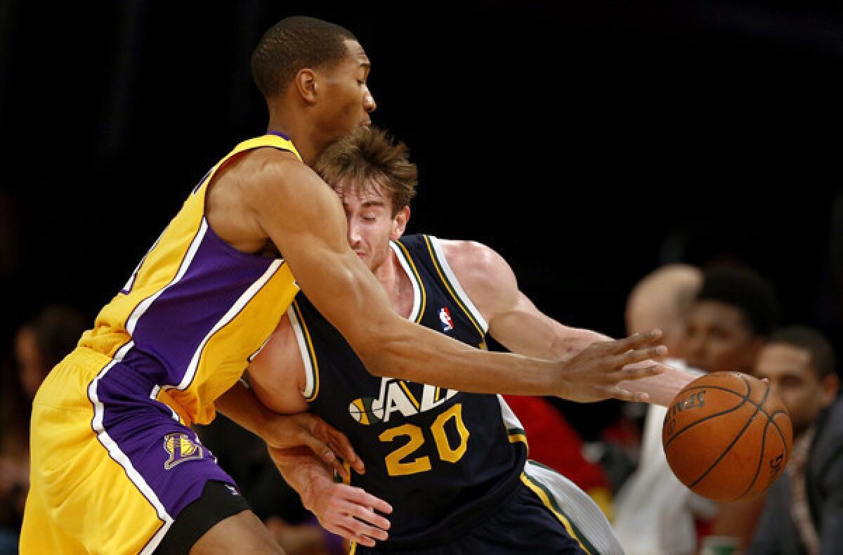 Lakers forward Wesley Johnson tries to cut off a drive by Utah Jazz forward Gordon Hayward during a Lakers victory at Staples Center on Jan. 3.