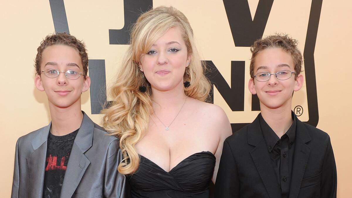 "Everybody Loves Raymond" actor Sawyer Sweeten, left, is shown with sister Madylin Sweeten and twin brother Sullivan Sweeten at the TV Land Awards on April 17, 2010