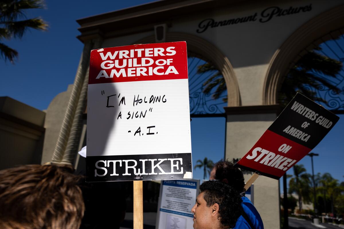 Members of the Writers Guild of America, joined by members of SAG-AFTRA, come together to picket.