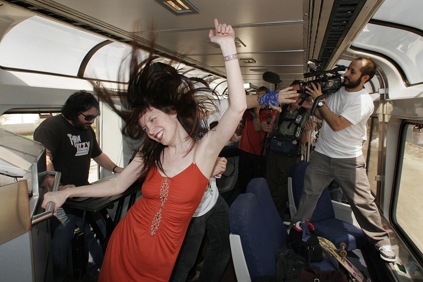 Kestrin Pantera dancing to a live DJ aboard a special Amtrak charter, the Coachella Express, someplace between Los Angeles and Indio, April 24,2008.