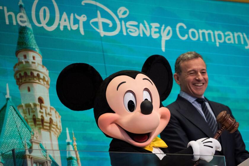NEW YORK, NY - NOVEMBER 27: (L to R) Mickey Mouse and chief executive officer and chairman of The Walt Disney Company Bob Iger prepare to ring the opening bell at the New York Stock Exchange (NYSE), November 27, 2017 in New York City. Disney is marking the company's 60th anniversary as a listed company on the NYSE. (Drew Angerer/Getty Images) ** OUTS - ELSENT, FPG, CM - OUTS * NM, PH, VA if sourced by CT, LA or MoD **