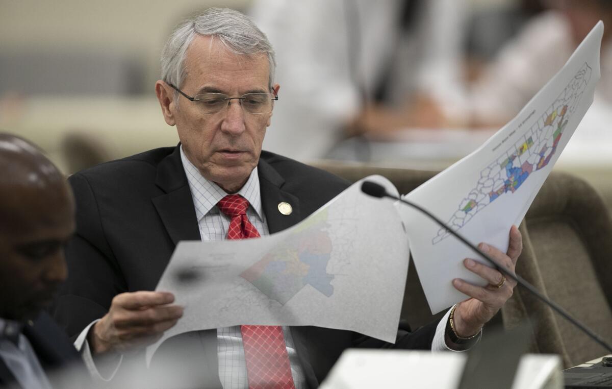 North Carolina state Rep. John Szoka looks over a redistricting map during a committee meeting at the Legislative Office Building in Raleigh, N.C.