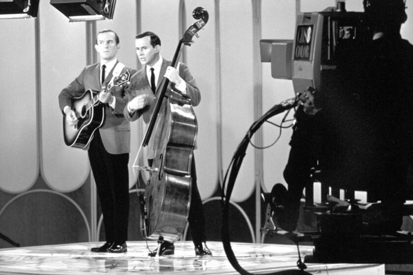 Story Slug: li04smothersa.JFIF.txt.ART Comedians Tommy, left, and Dick Smothers perform during a taping of "The Smothers Brothers Show," in this undated publicity photo. The brothers' battles with CBS and the rest of the Establishment are told in "Smothered: The Censorship Struggles of 'The Smothers Brothers Comedy Hour','' airing on Bravo Wednesday, Dec. 4, 2002, at 8 p.m. EST. (AP Photo/Bravo) ORG XMIT: NY341