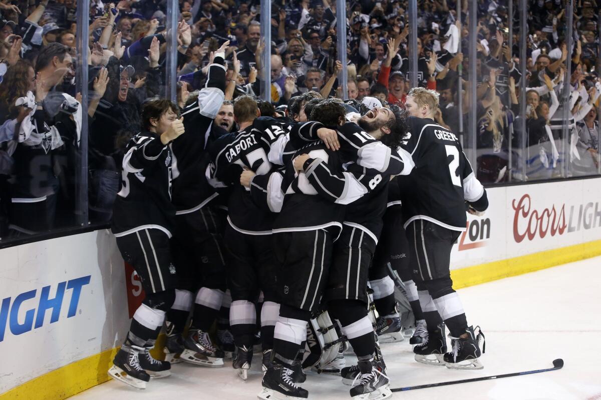 Kings fans cheer the players as they celebrate their double-overtime victory over the Rangers on Friday night.