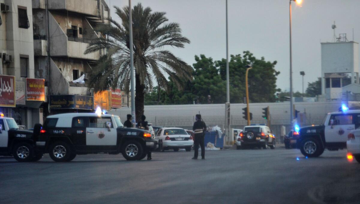 Saudi policemen stand guard at the site where a suicide bomber blew himself up in the early hours of July 4, 2016 near the American consulate in the Red Sea city of Jeddah.