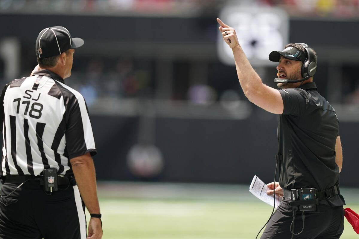 Philadelphia Eagles head coach Nick Sirianni speaks to an offical during the first half of an NFL football game between the Atlanta Falcons and the Philadelphia Eagles, Sunday, Sept. 12, 2021, in Atlanta. (AP Photo/Brynn Anderson)
