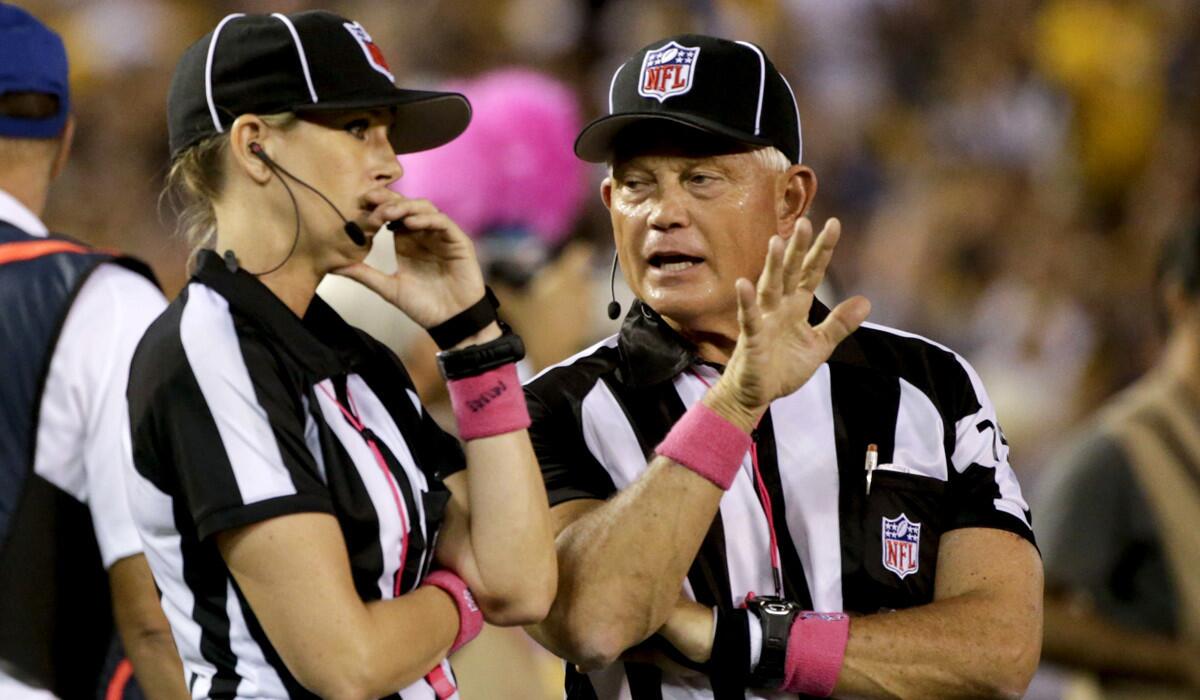 Line judge Sarah Thomas, left, talks with side judge Rob Vernatchi as the San Diego Chargers play the Pittsburgh Steelers during the second half in San Diego on Monday.