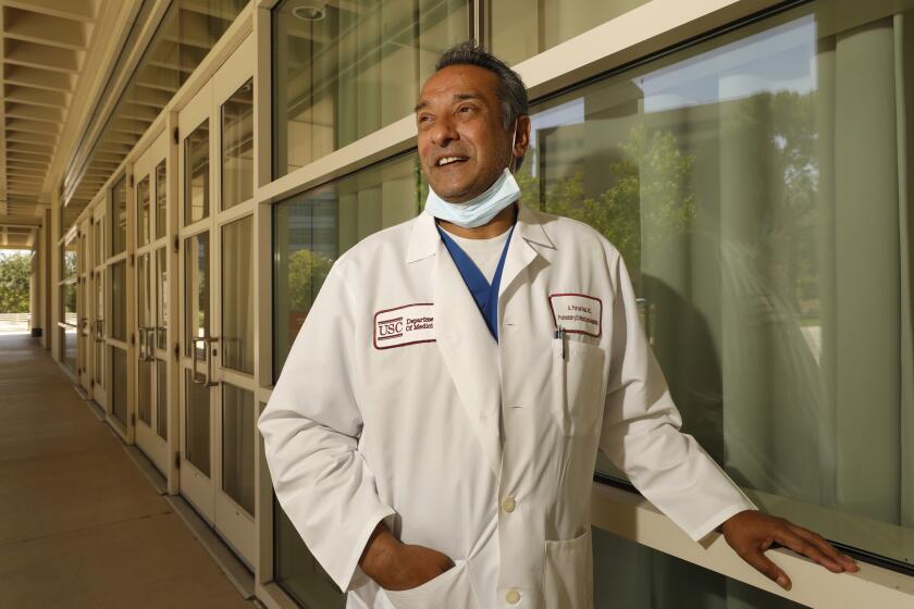 LOS ANGELES, CA - JULY 14: Adupa Purush Rao M.D. is a pulmonologist on the front lines at Keck Hospital of USC and is a Associate Professor at the Keck School of Medicine of USC. Keck Hospital of USC on Tuesday, July 14, 2020 in Los Angeles, CA. (Al Seib / Los Angeles Times)