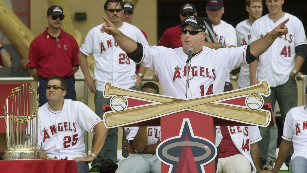 Mike Scioscia addresses fans during the celebration of the Angels' World Series championship