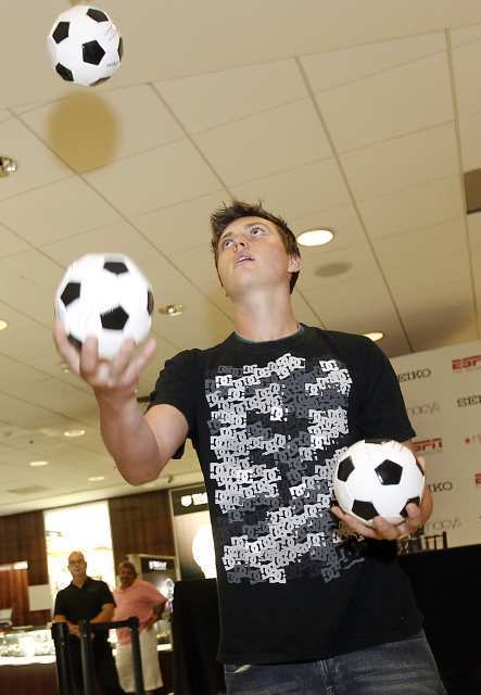 Nick Johnston, 15, of Lake Forest juggles, in a competition to win a $10 Macy's gift certificate, as he waits to meet Landon Donovan of the L.A. Galaxy.