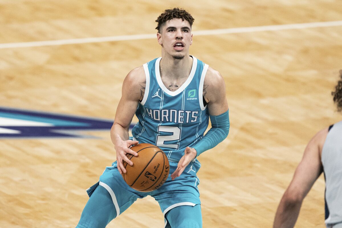 Charlotte Hornets guard LaMelo Ball (2) shoots the ball against the Washington Wizards during an NBA basketball game.