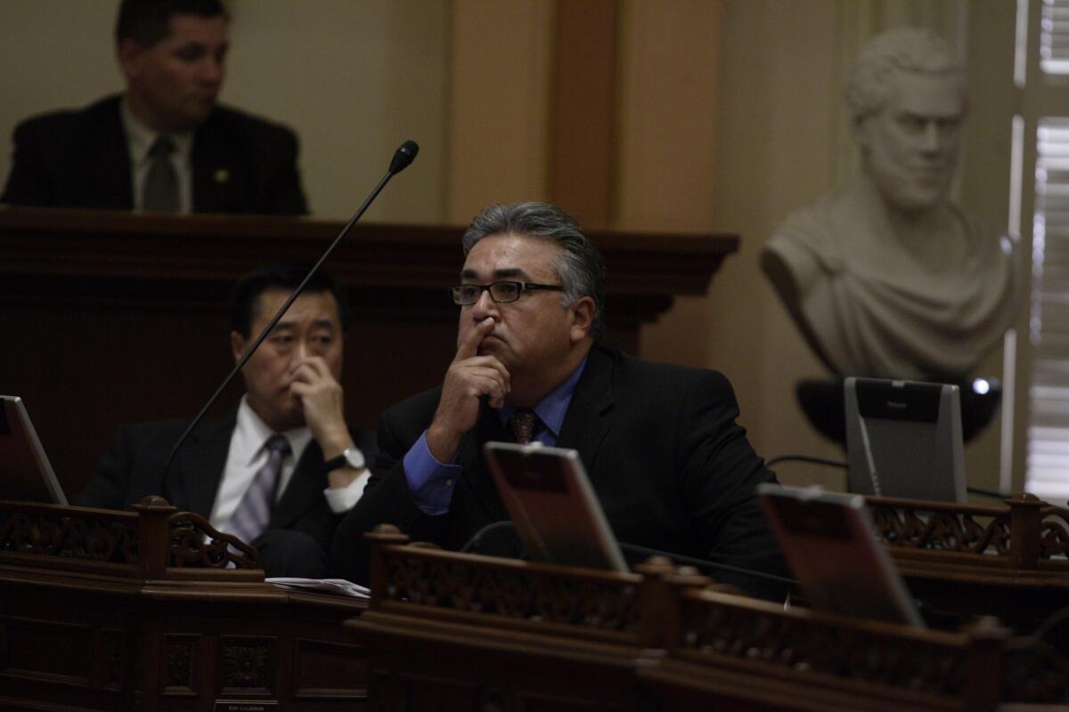 Sen. Ron Calderon, right, on the floor of the state Senate in 2007, with Sen. Leland Yee to his left. A judge in Sacramento this week ordered the release of their calendars and other office documents requested by the press.