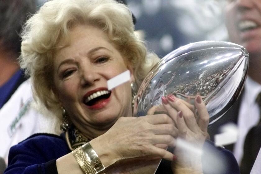 St. Louis Rams owner Georgia Frontiere hugs the Super Bowl trophy after the Rams beat the Tennessee Titans 23–16 in Atlanta on Jan. 30, 2000.