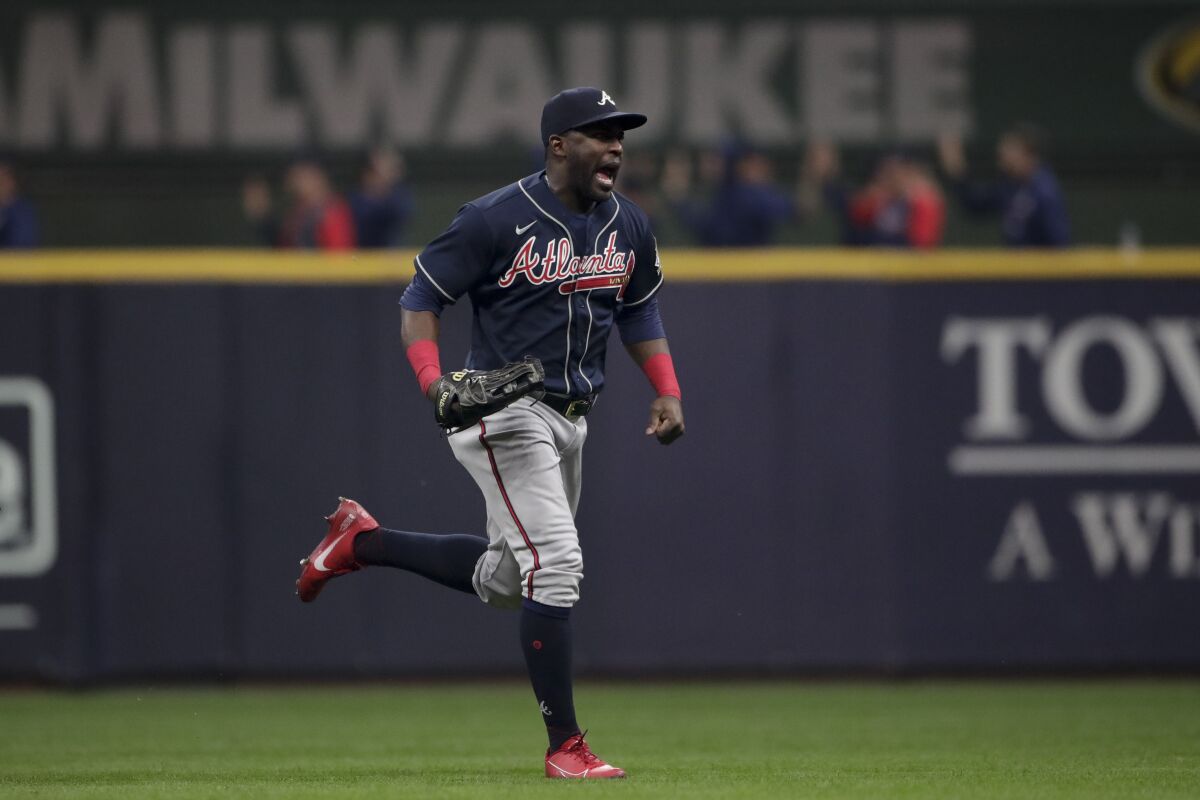 Atlanta Braves right fielder Jorge Soler celebrates their win against the Milwaukee Brewers in Game 2 of baseball's National League Divisional Series Saturday, Oct. 9, 2021, in Milwaukee. (AP Photo/Aaron Gash)