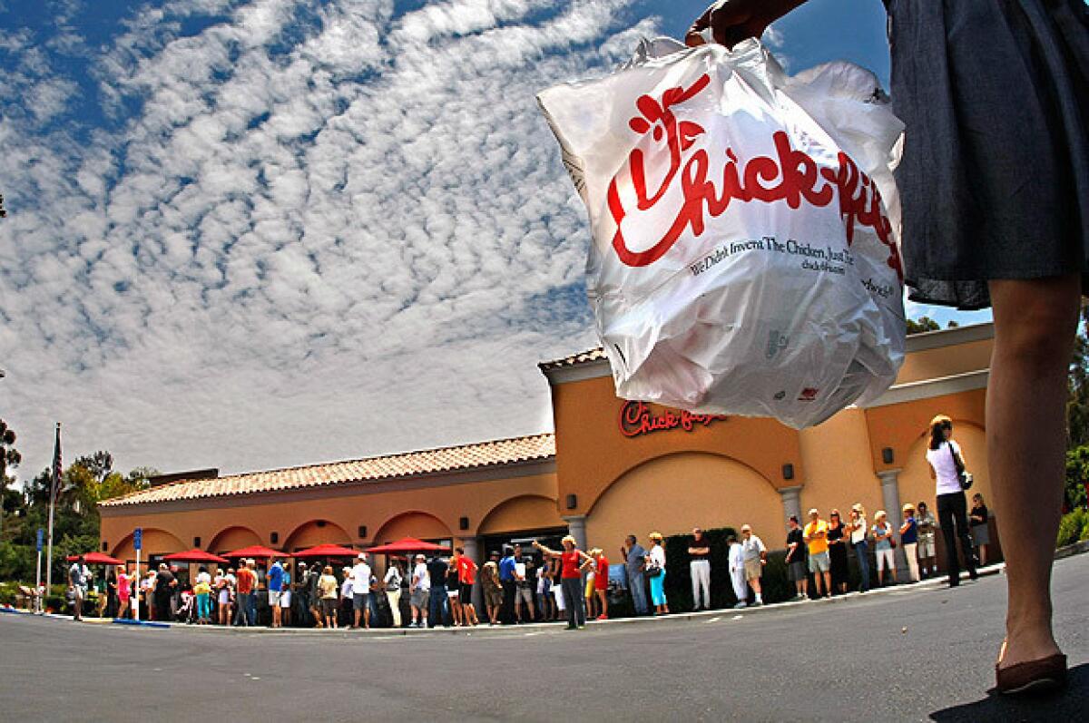 Hundreds of customers line up to get in the Chick-fil-A restaurant in Laguna Niguel.