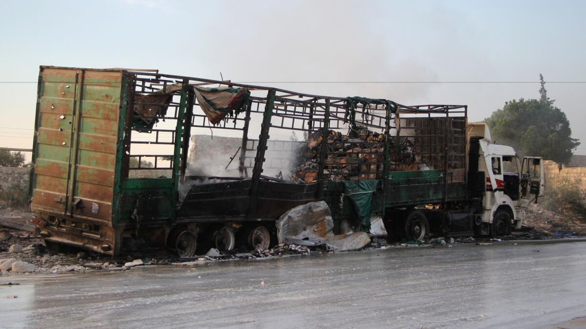 A truck that had been carrying aid supplies sits, destroyed, on the western outskirts of Aleppo, Syria, on Tuesday.