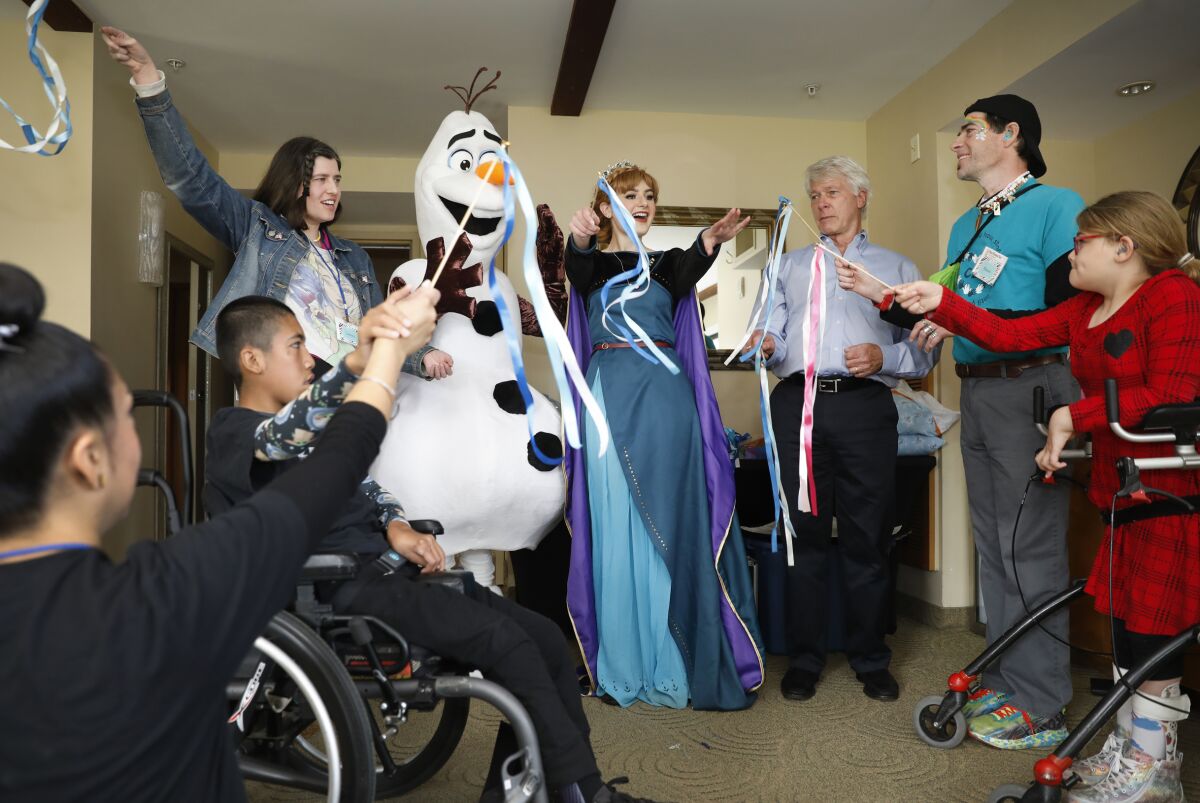 Standing from left, Lauren Papworth, "Frozen" characters, scientist Hudson Freeze, Shaun Papworth and Grace Thoma