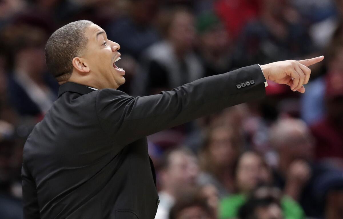 Then-Cleveland Cavaliers coach Tyronn Lue yells instructions to players during a game against the Boston Celtics.