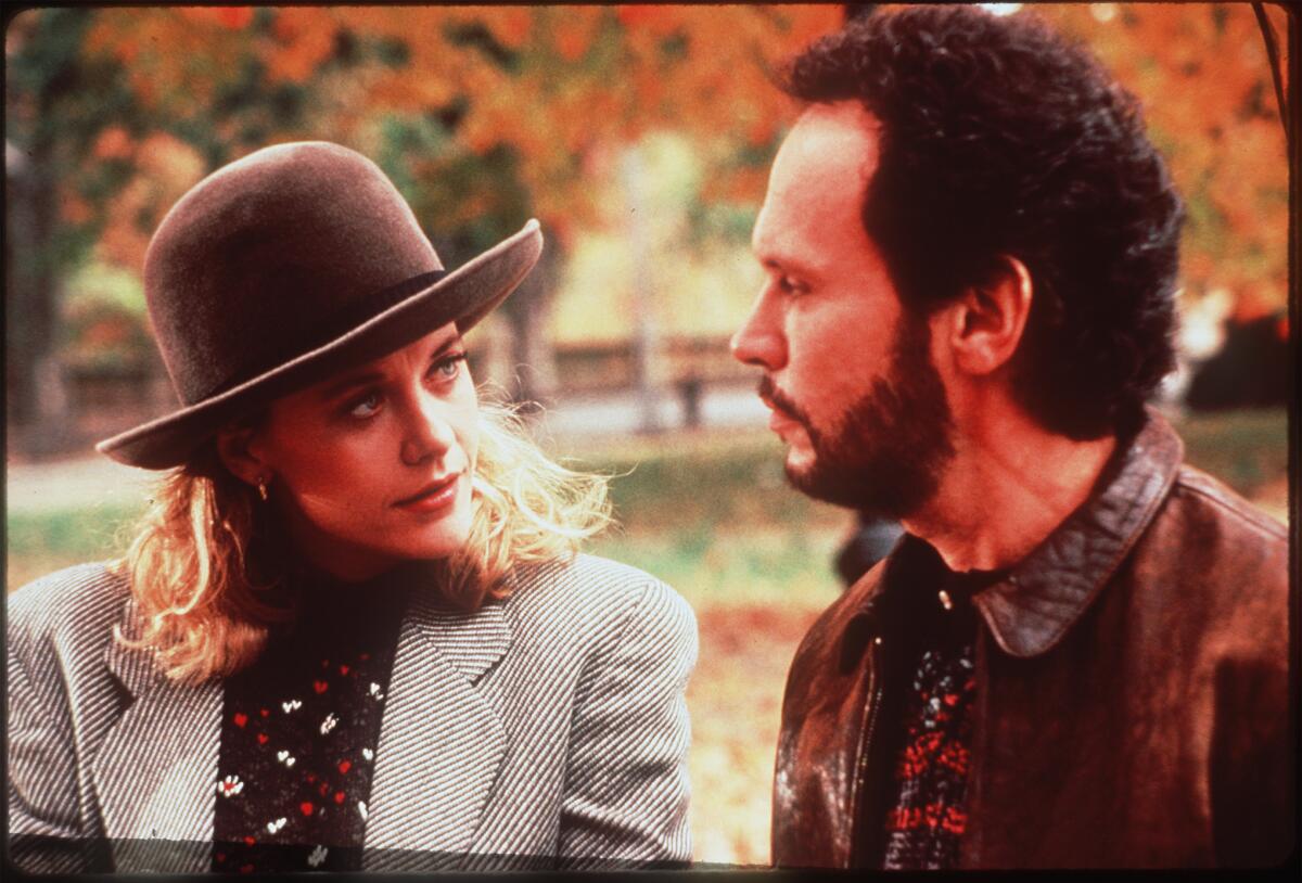 Billy Crystal and Meg Ryan talk while walking in the park