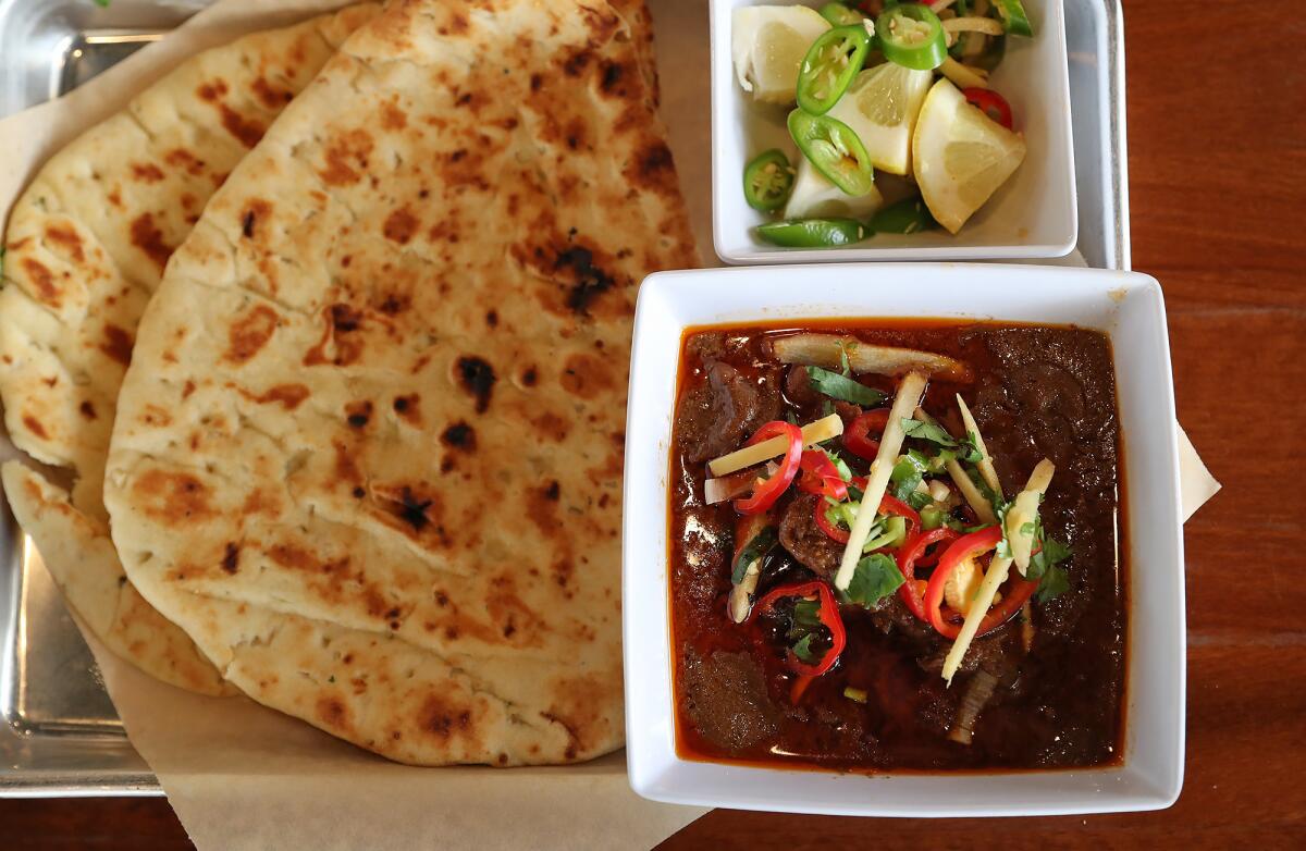 Slow cooked nihari, a braised beef dish popular in Pakistan on Burns Road's weekend menu.