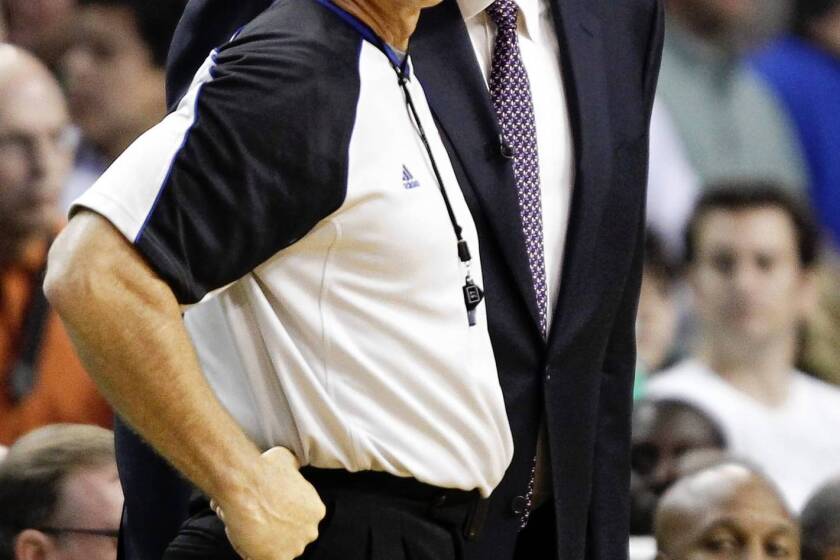 Referee Greg Willard hears questions from then-Lakers coach Phil Jackson during Game 4 of the NBA finals against the Boston Celtics on June 10, 2010. Willard, a longtime referee in the NBA, has died at age 54.