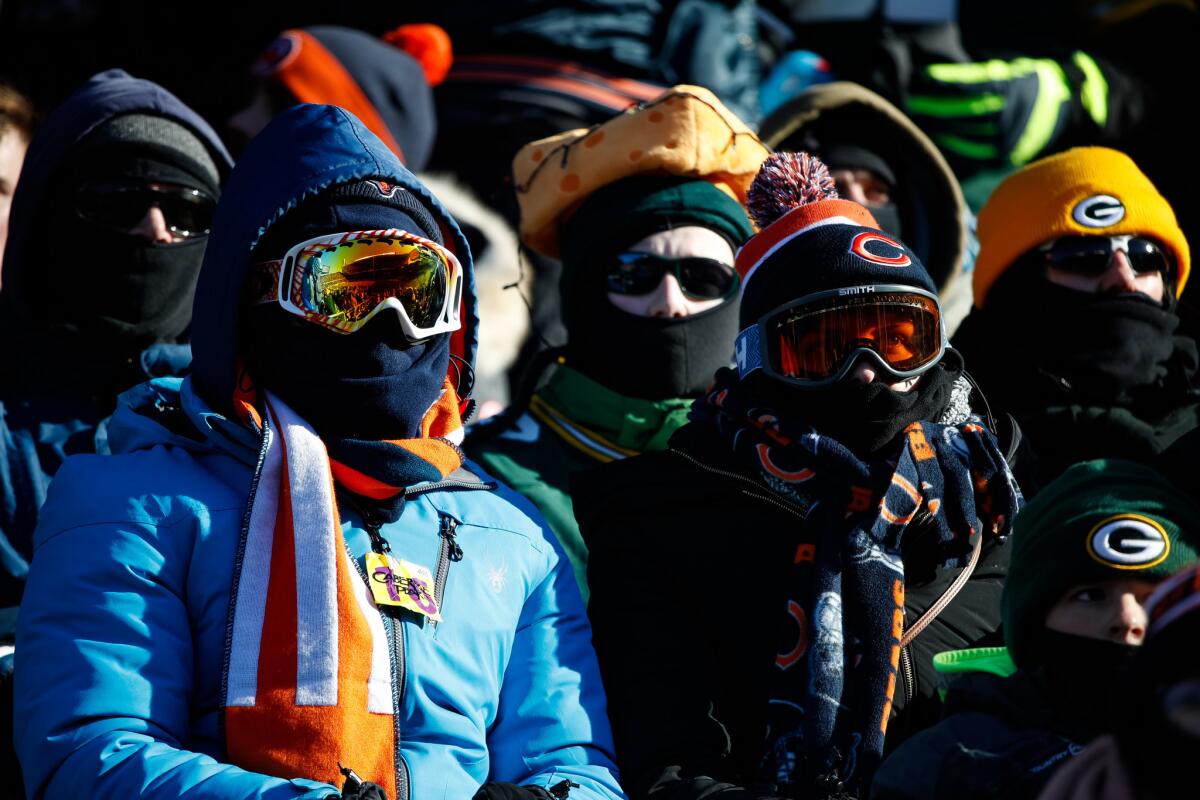 Fans brave the cold weather during the game between the Bears and the Packers at Soldier Field in Chicago on Dec. 18.