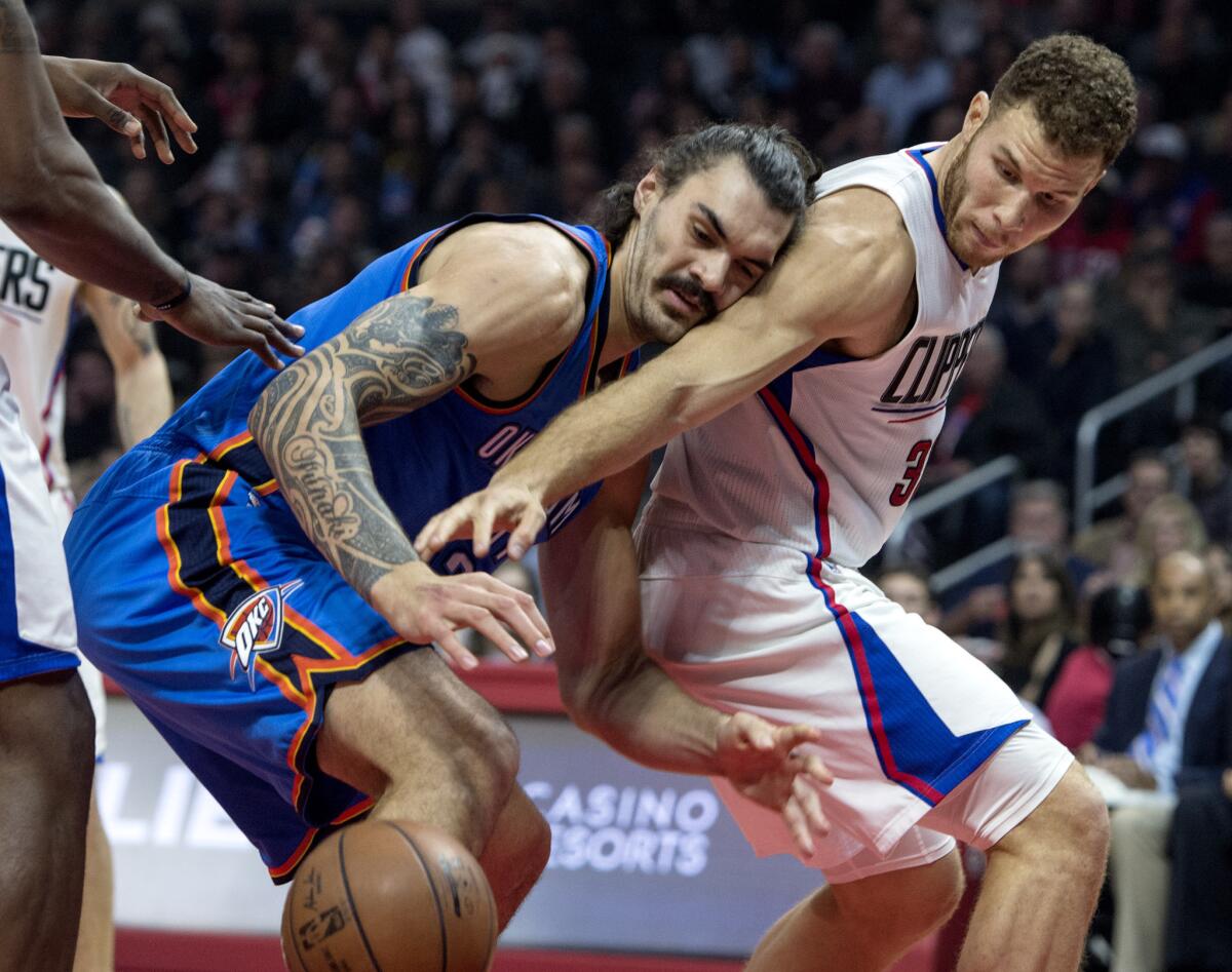 Blake Griffin, right, and Oklahoma City's Steven Adams vie for a loose ball.