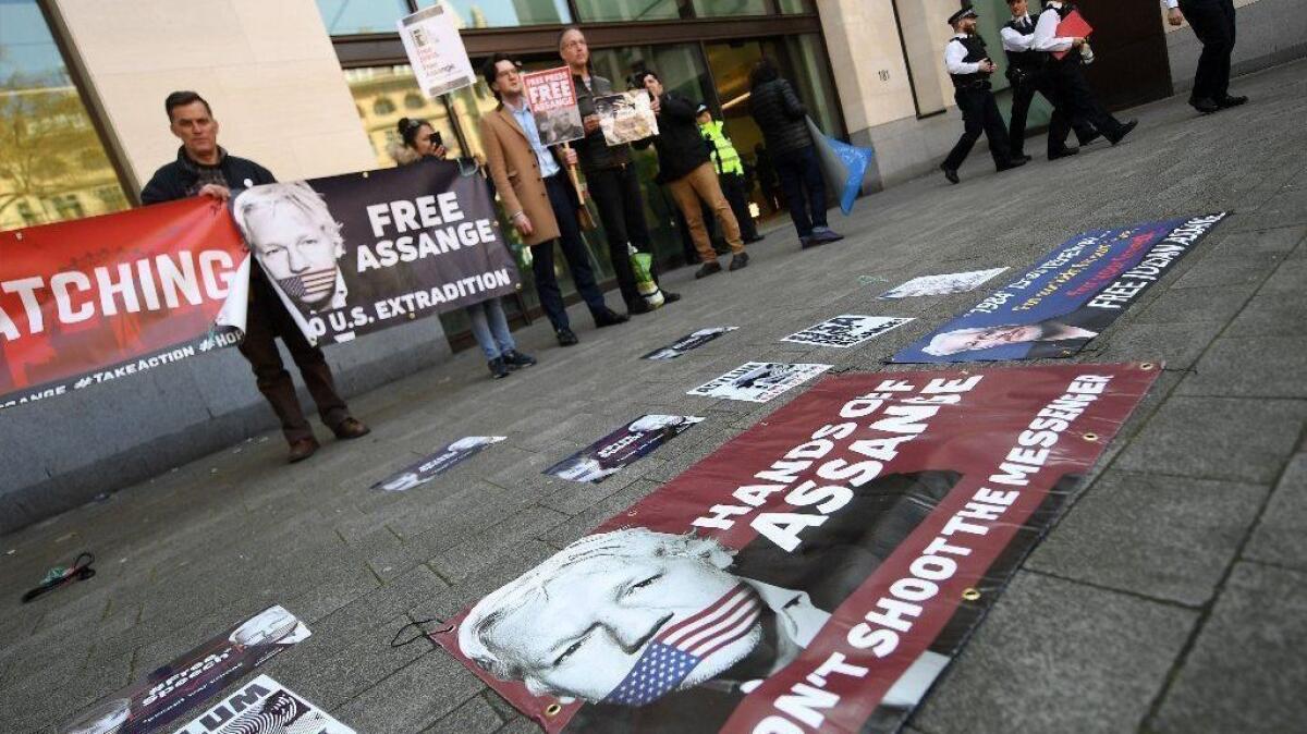 Supporters of WikiLeaks founder Julian Assange rally for his release outside Westminster Magistrates Court in London on April 11.