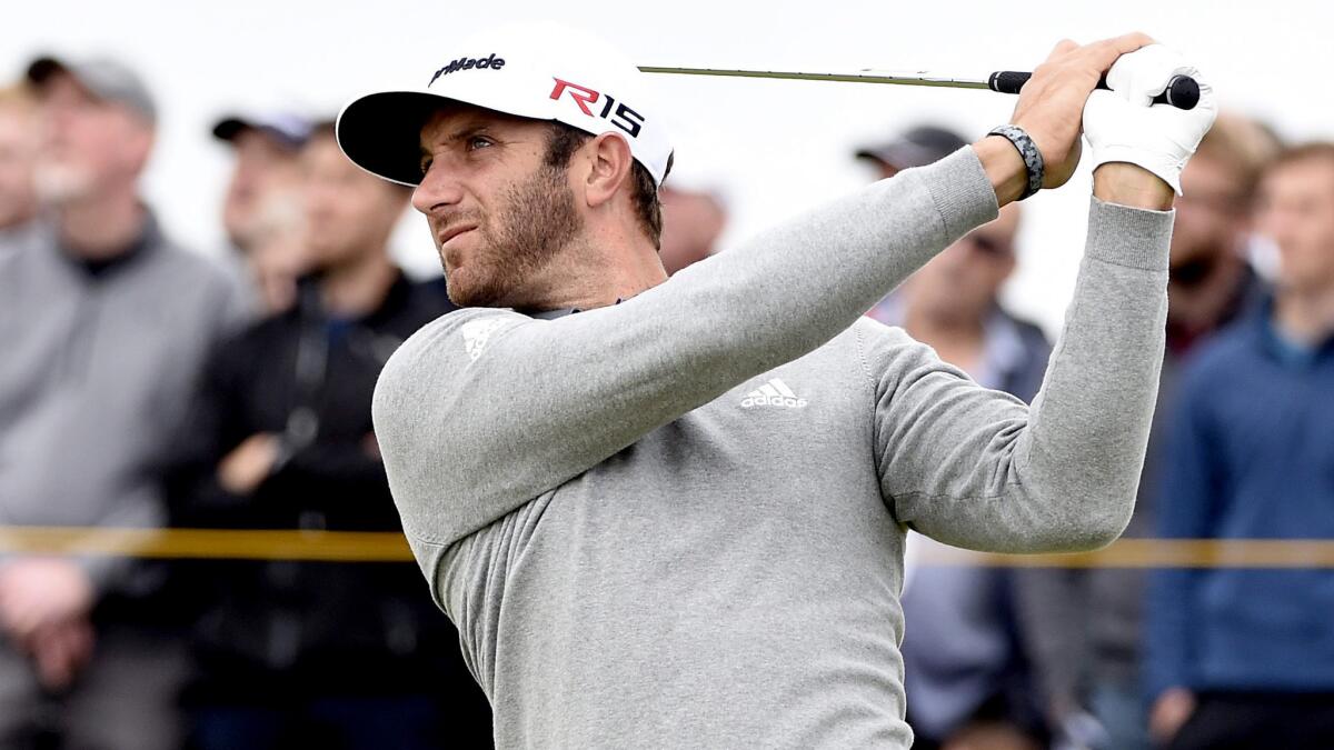 Dustin Johnson shot a 65 in the first round of the British Open on Thursday at St. Andrews' Old Course.