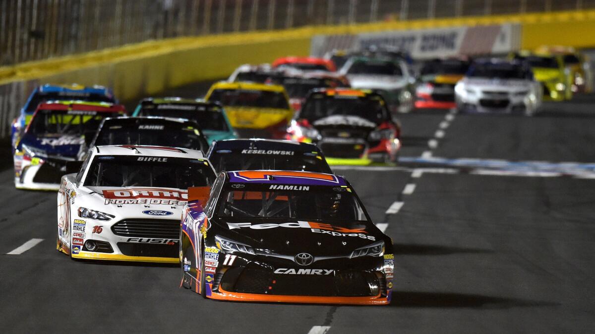 NASCAR driver Denny Hamlin leads the pack during the Sprint All-Star Race at Charlotte Motor Speedway on Saturday night.