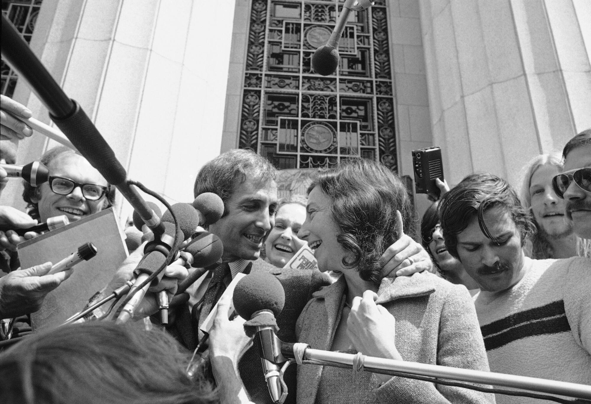 Daniel Ellsberg is all smiles with his wife Pat as they emerge from the Federal building in Los Angeles on May 11, 1973.