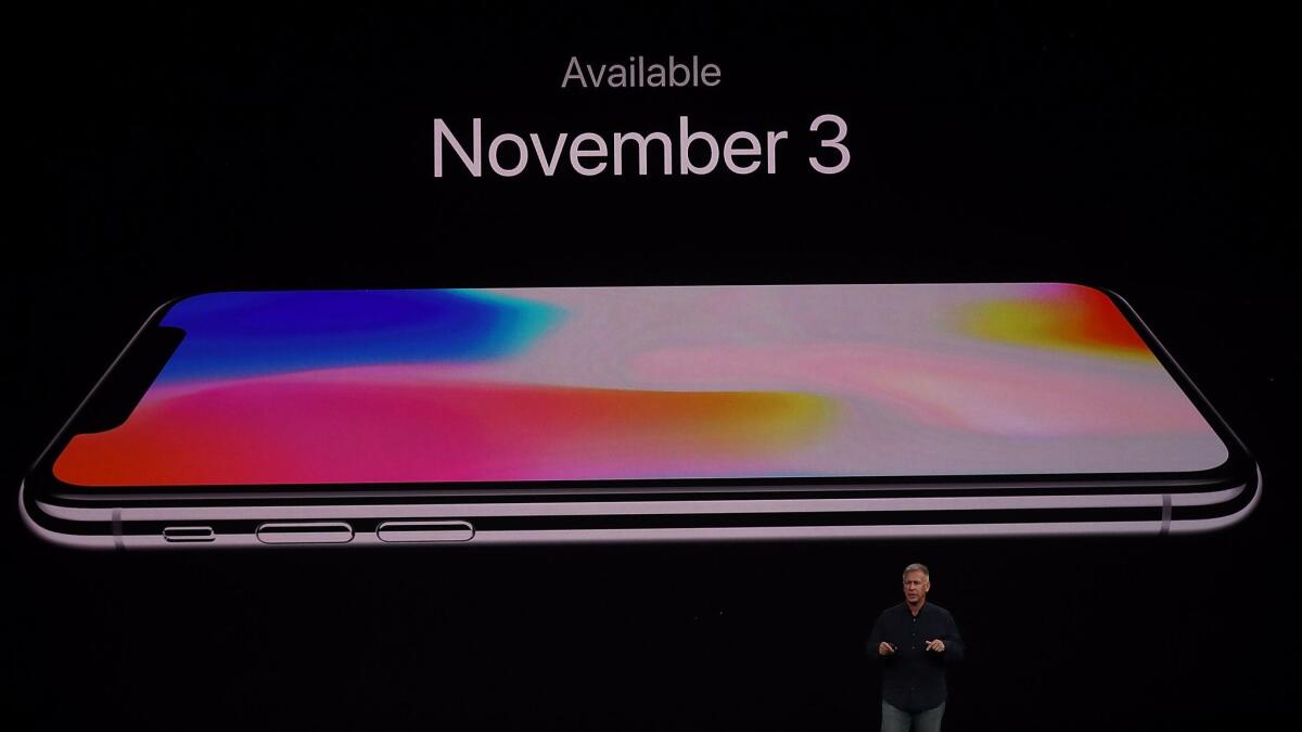 Apple executive Phil Schiller introduces the iPhone X at a product launch event in September.