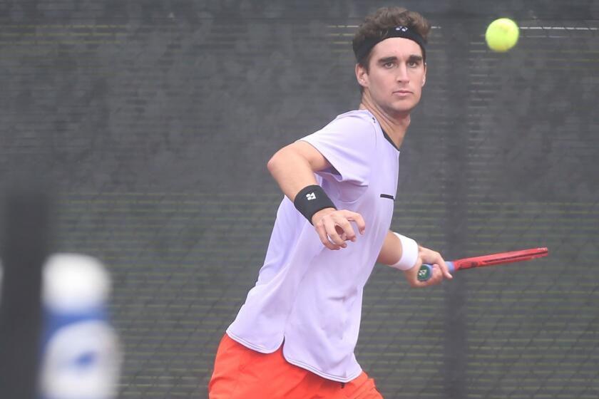 Number one seed Max McKennon eyes a forehand in match against opponent Tyler Davis, in the boys??? 18-and-under singles round of 16 at the USTA Southern California Junior Sectional Championships at Costa Mesa Tennis Center on Friday.
